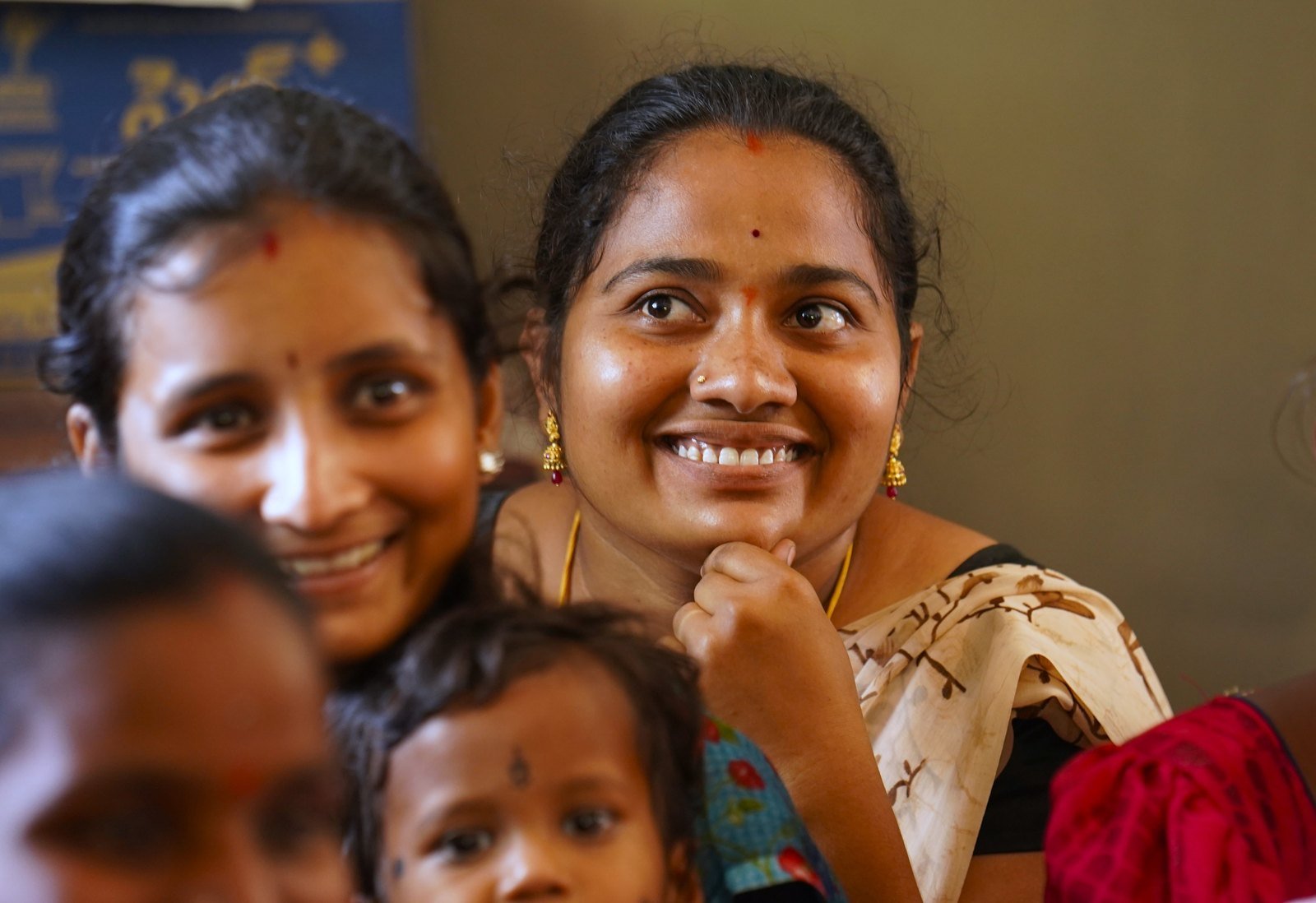 An Indian mother and her child smiling together with warmth and hope